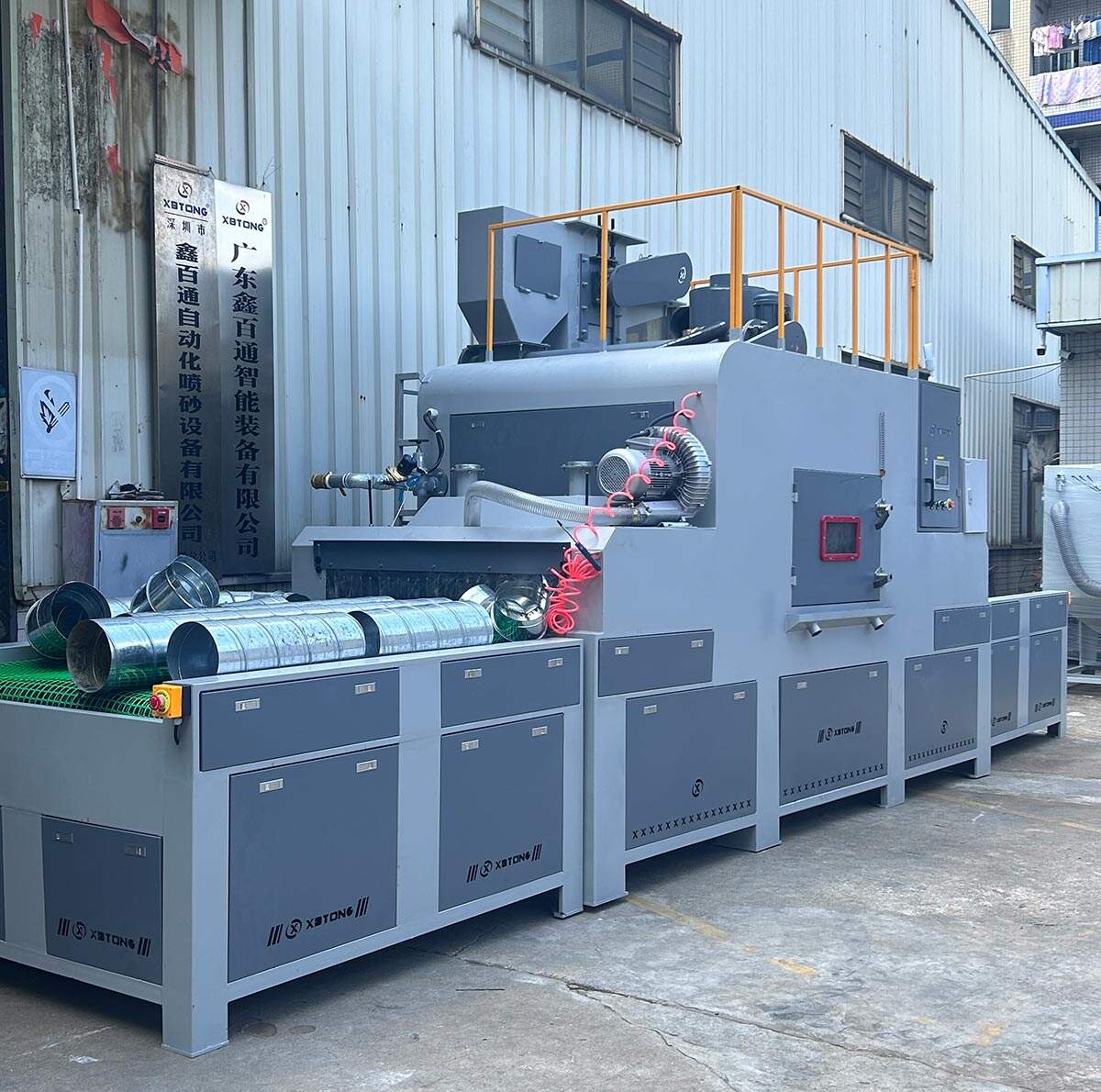 鑫百通品牌输送式自动喷砂机设备